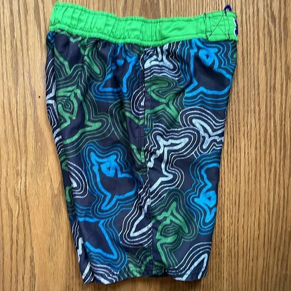 Cherokee swimming shorts. Drawstring waist. Size medium (10/12). Pockets.